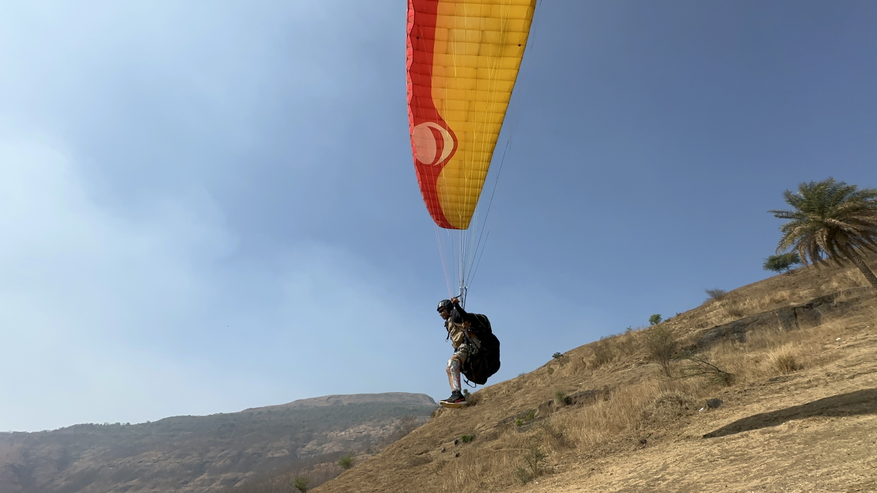 Lt Col DD Goel paragliding with his prosthetic leg visible